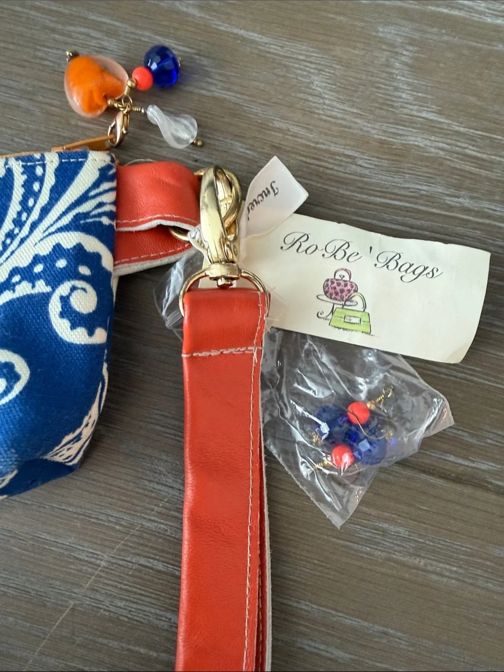 Orange and Blue Paisley ID/Cosmetic Pouch with wristlet sleeve.